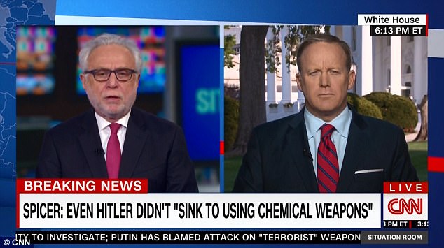 Press Secretary Sean Spicer (right) made his apology to CNN's Wolf Blitzer (left), whose paternal grandparents perished at Auschwitz and whose parents survived the Holocaust 