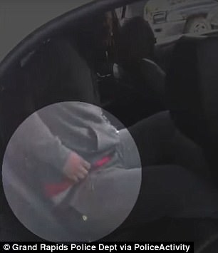 Bodycam footage shows him reaching into his pants for a gun (highlighted) before opening fire on police
