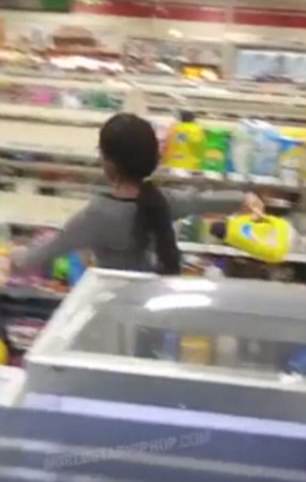 She takes thing off the shelves and hurls them at the man and the employees