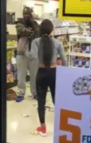 One of the women starts to fight with a man who does not appear to be an employee
